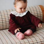 Baby girl wearing Lalaby Alpha shoes in sorbet pink cashmere