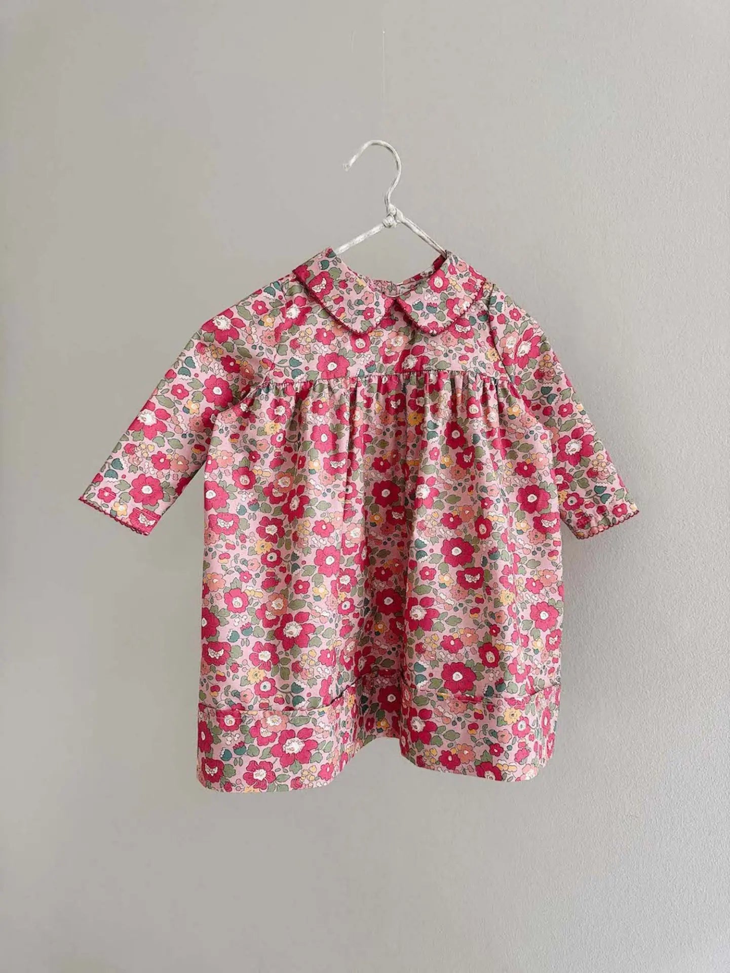 Lalaby Anna dress for babies in berry betsy pink liberty organic cotton