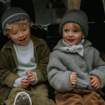 Boy wearing Lalaby Atlas scarf in bluey light blue cashmere
