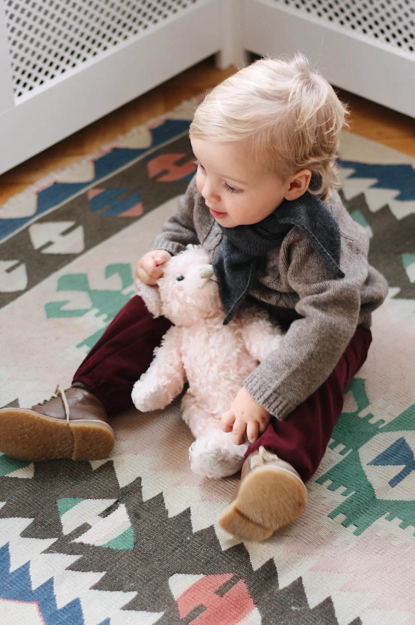 Baby boy wearing Lalaby Atlas scarf for babies, kids and adults in storm grey cashmere