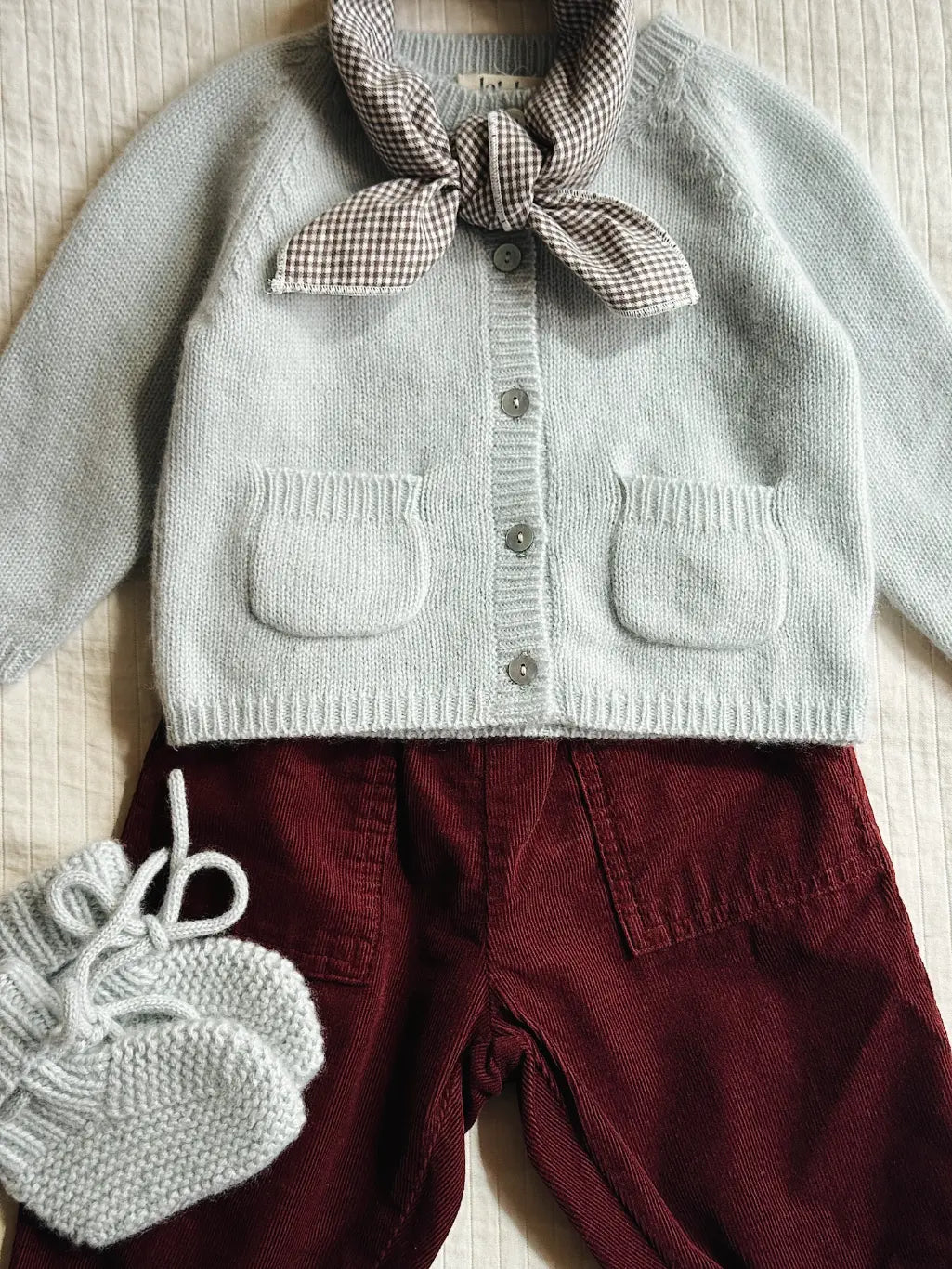 Lalaby baby boy look in shades of bluey, ruby and tiny check brown.