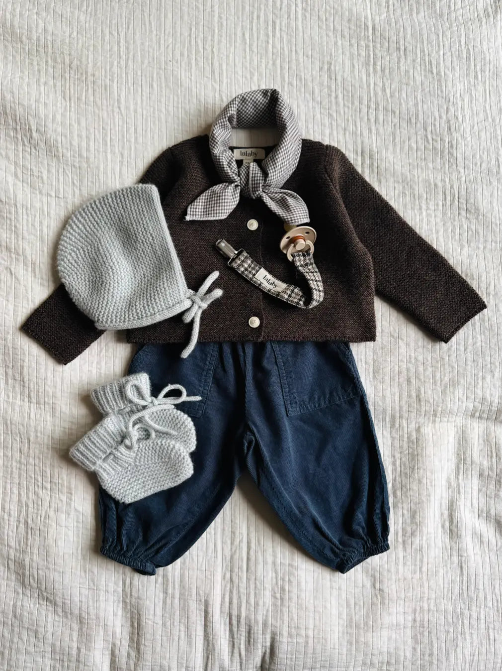 Lalaby AW26 baby boy look in shades of chocolate, whale, bluey, tweedy & tiny check brown