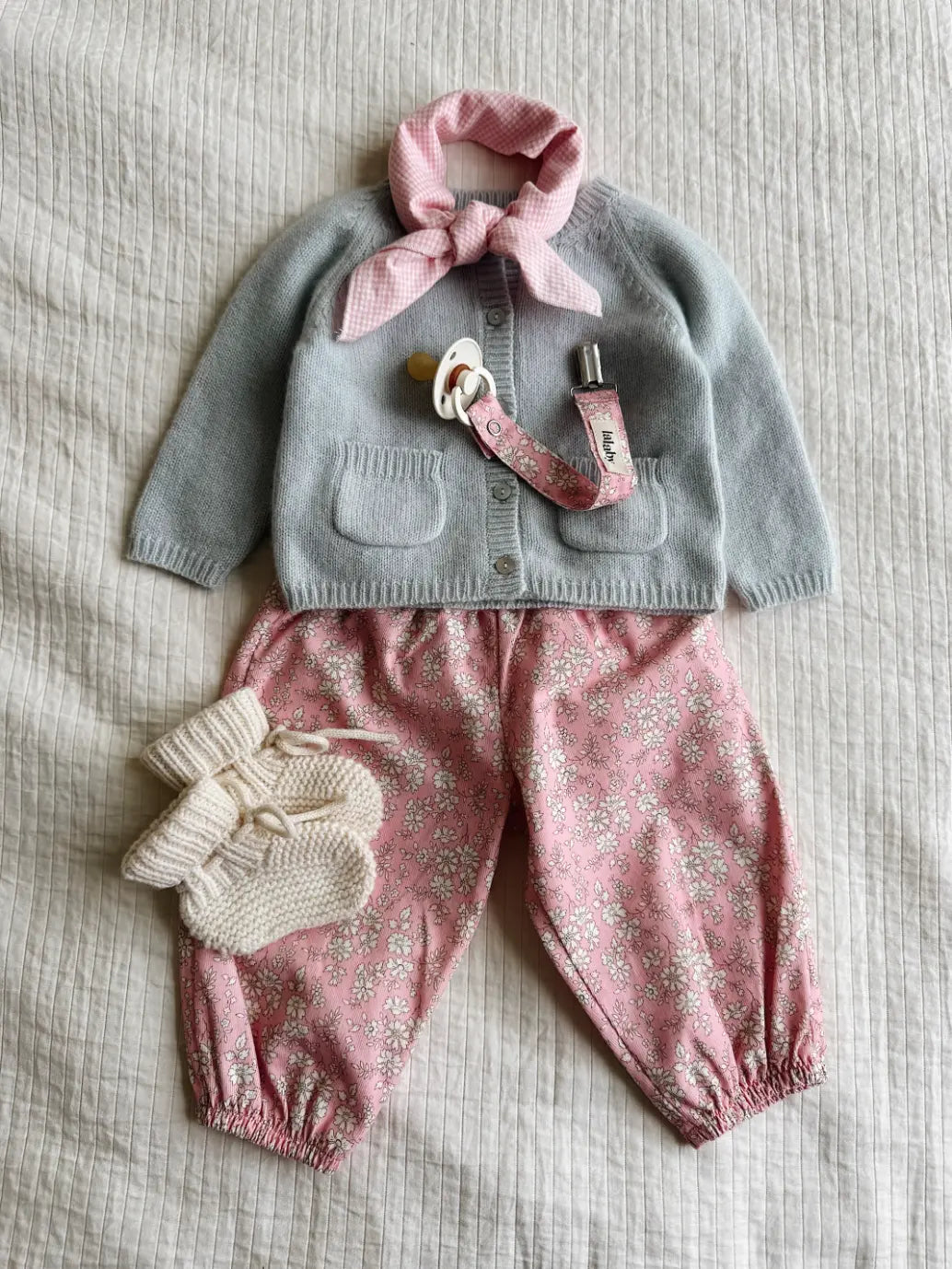 Lalaby AW26 baby girl look in shades of bluey, pink flower cord, natural & tiny check pink