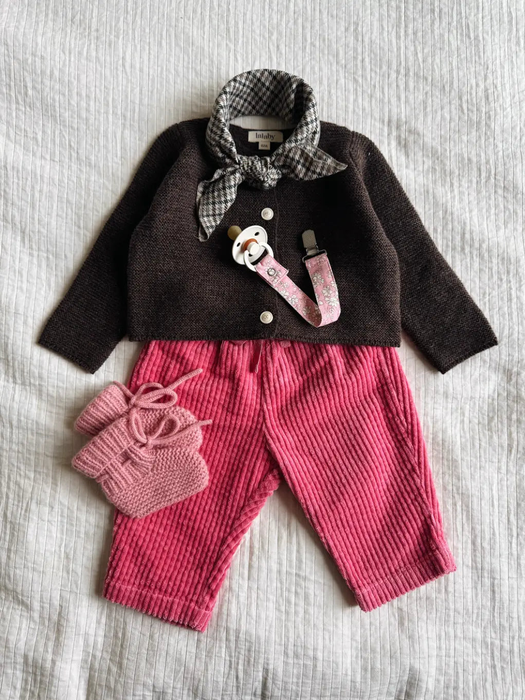 Lalaby AW26 baby girl look in shades of chocolate, flamingo, sorbet & tiny check pink