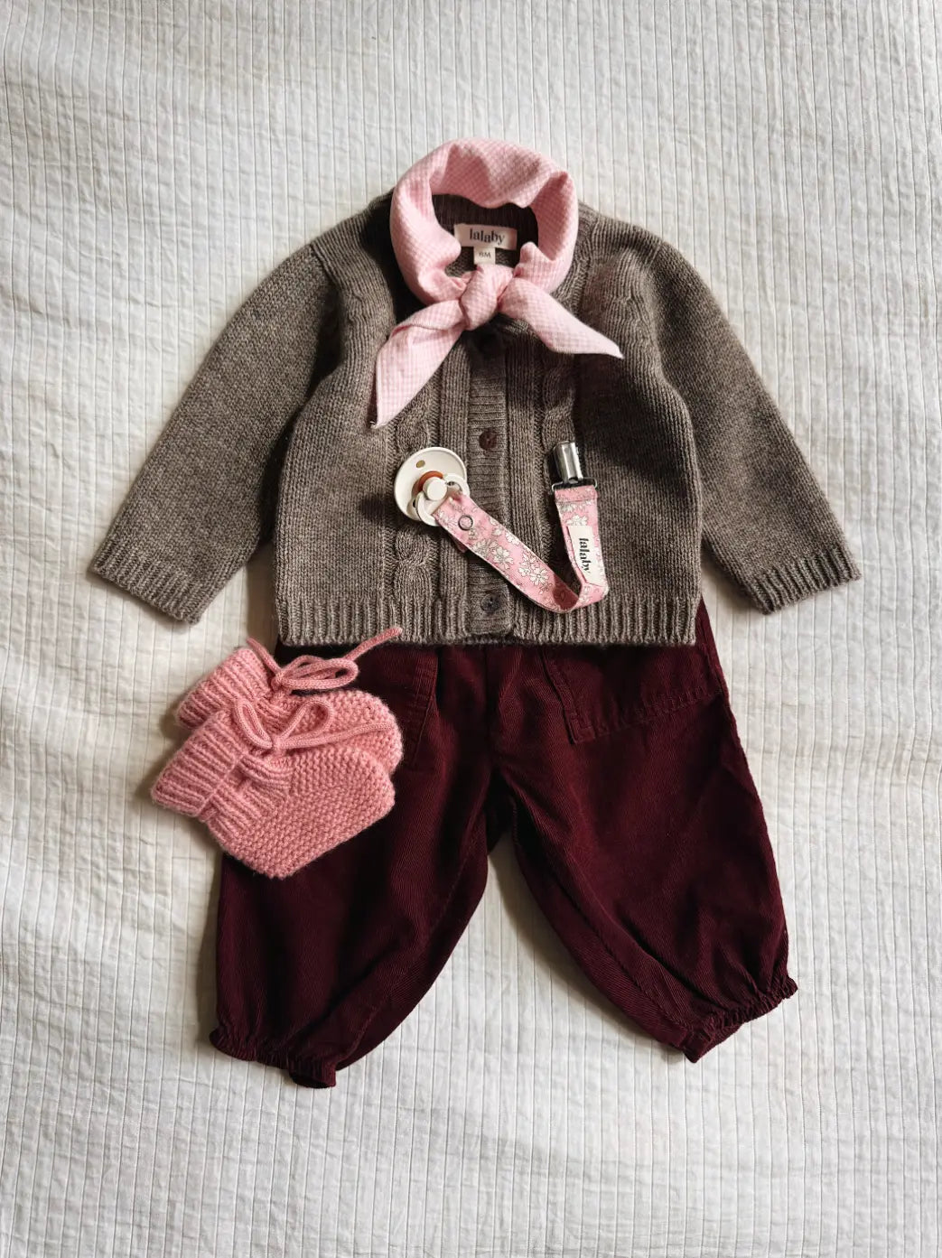 Lalaby AW26 baby girl look in shades of millet, ruby, sorbet, pink flower cord & tiny check pink
