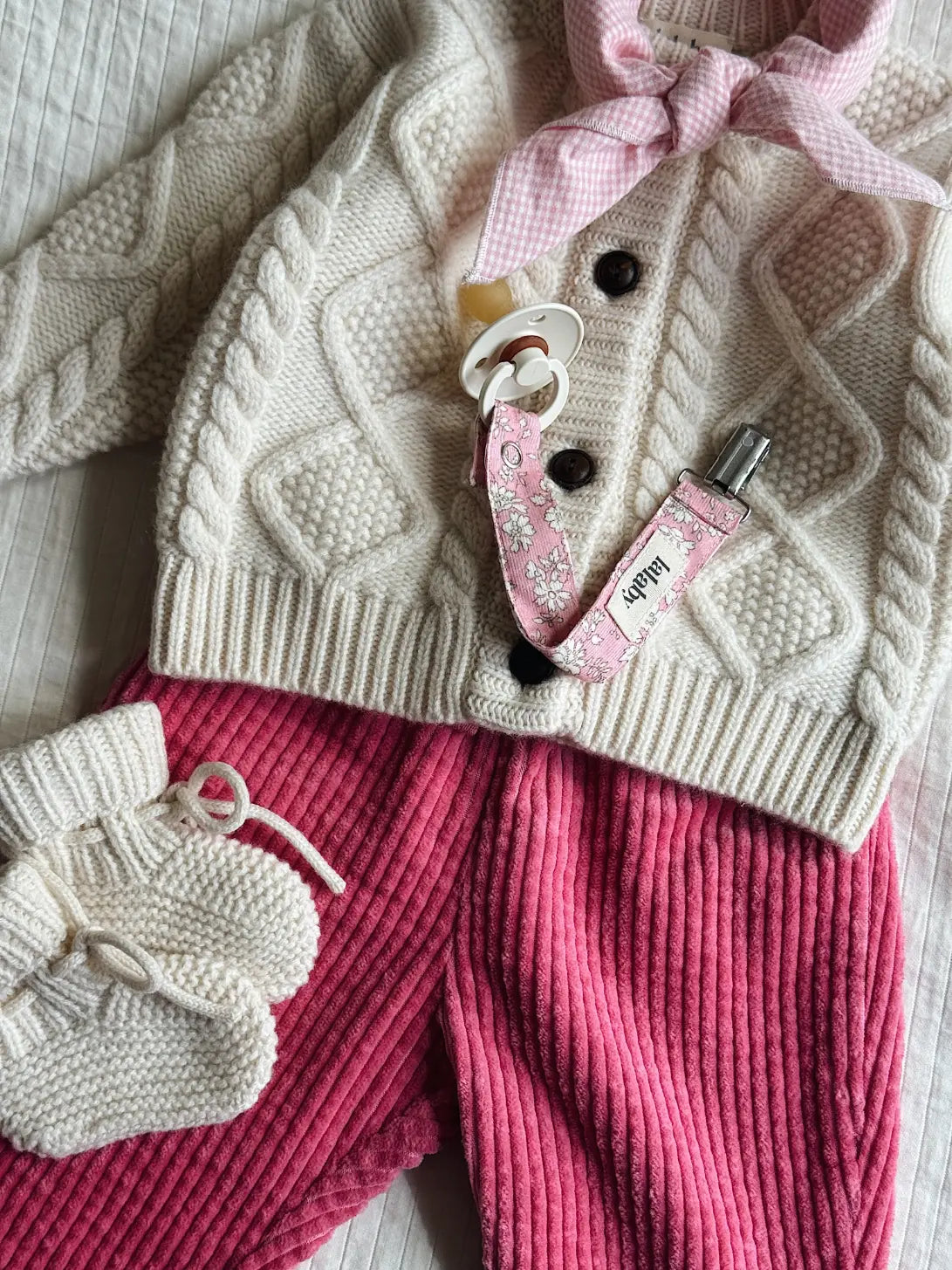 Lalaby AW26 baby girl look in shades of natural, flamingo, pink flower cord & tiny check pink