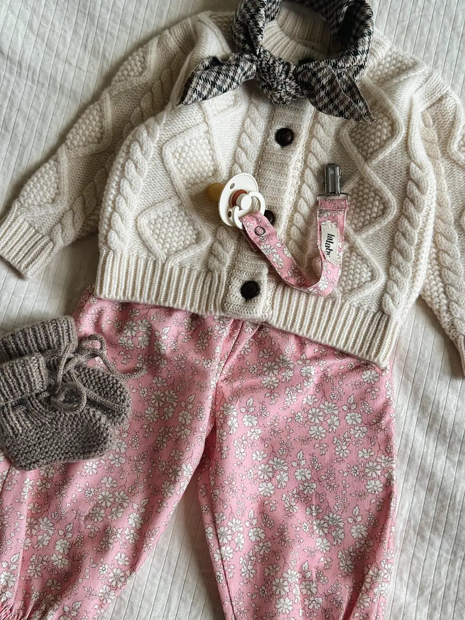 Lalaby AW26 baby girl look in shades of natural, pink flower cord, tweedy & millet