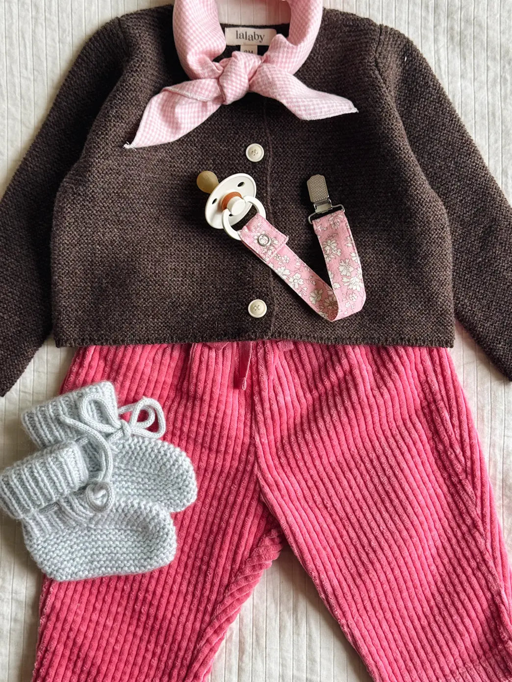 Lalaby AW26 baby girl look in shades of chocolate, flamingo, bluey & tiny check pink