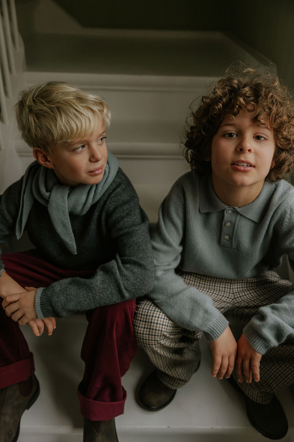 Boy wearing Lalaby Axel trousers for kids in ruby red cotton baby cord