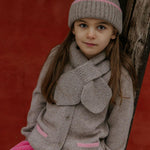 Girl wearing Lalaby Betty cardigan in toast brown cashmere