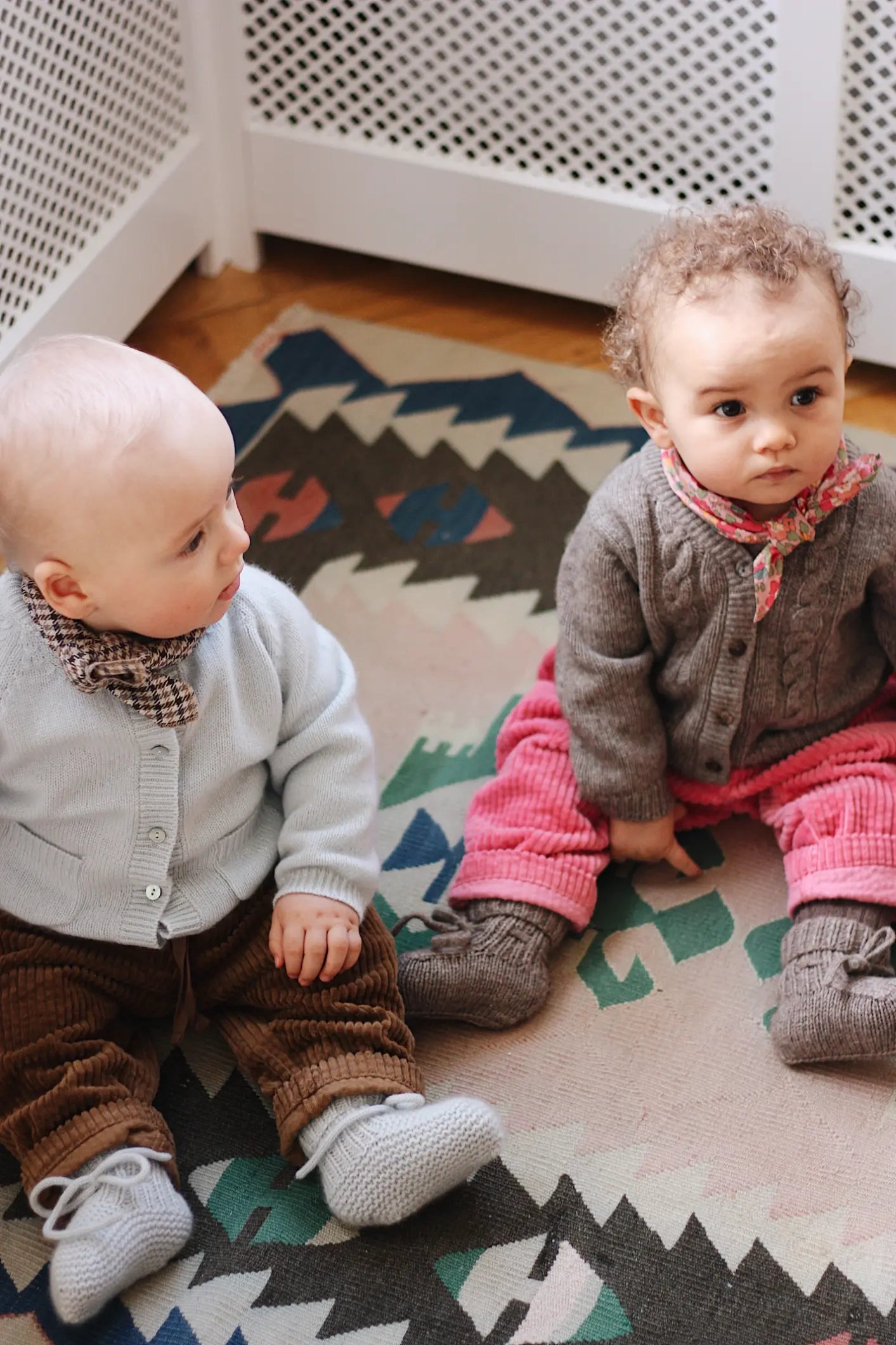 Baby boy wearing Lalaby Bobbie baby cardigan in bluey light blue cashmere