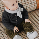 Baby wearing Lalaby Bobbie cardigan in storm grey cashmere