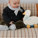 Baby wearing Lalaby Bobbie cardigan in storm grey cashmere