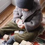 Baby boy wearing Lalaby Bobo hat in storm grey cashmere