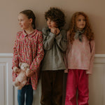 Boy wearing Lalaby Charlie trousers for kids in cookie brown organic cotton mega cord