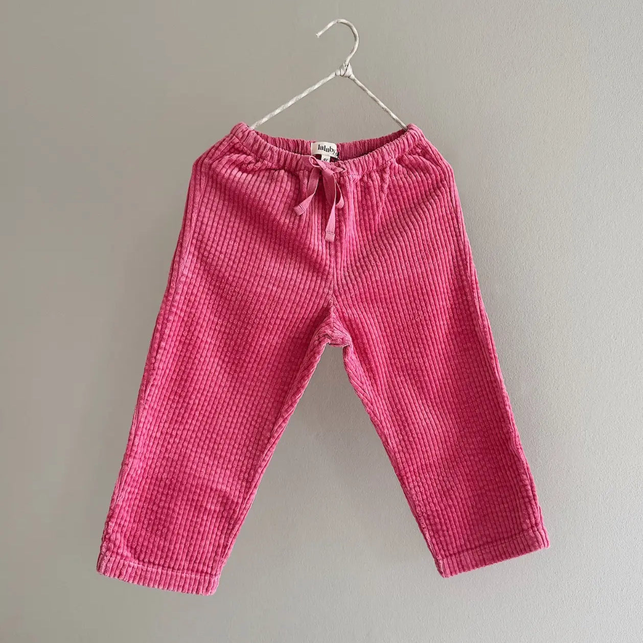 Lalaby Charlie trousers for kids in flamingo pink organic cotton mega cord
