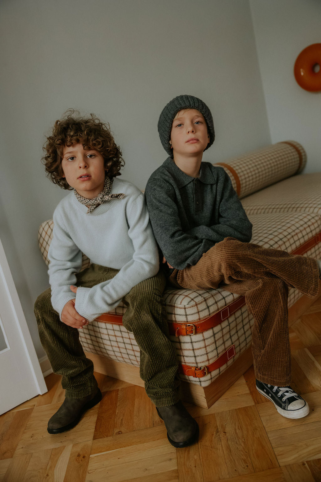 Boy wearing Lalaby Charlie kids trousers in forest green organic cotton mega cord