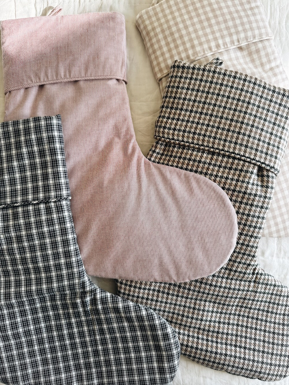 Selection of Lalaby Christmas stockings in 100% organic cotton; Tweedy, Winter check, Berry stripe & Bige gingham