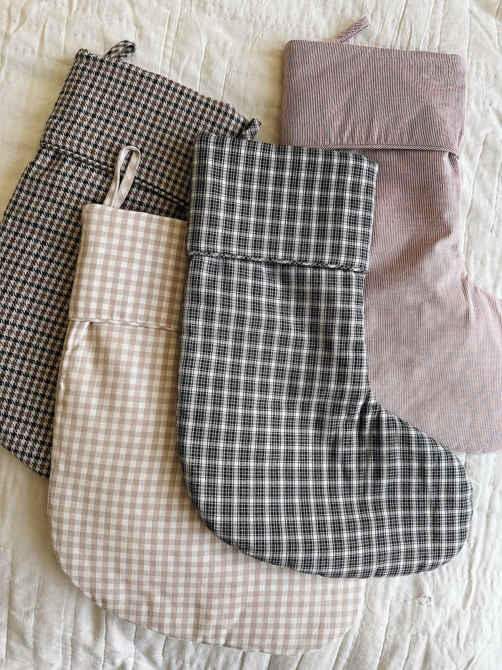 Selection of Lalaby Christmas stockings in 100% organic cotton; Tweedy, Winter check, Berry stripe & Bige gingham