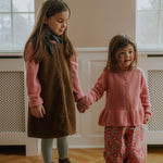 Girl wearing Lalaby Colin jumper in sorbet pink cashmere