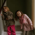 Girl wearing Lalaby Dagmar skirt for kids in pink flower liberty cotton corduroy