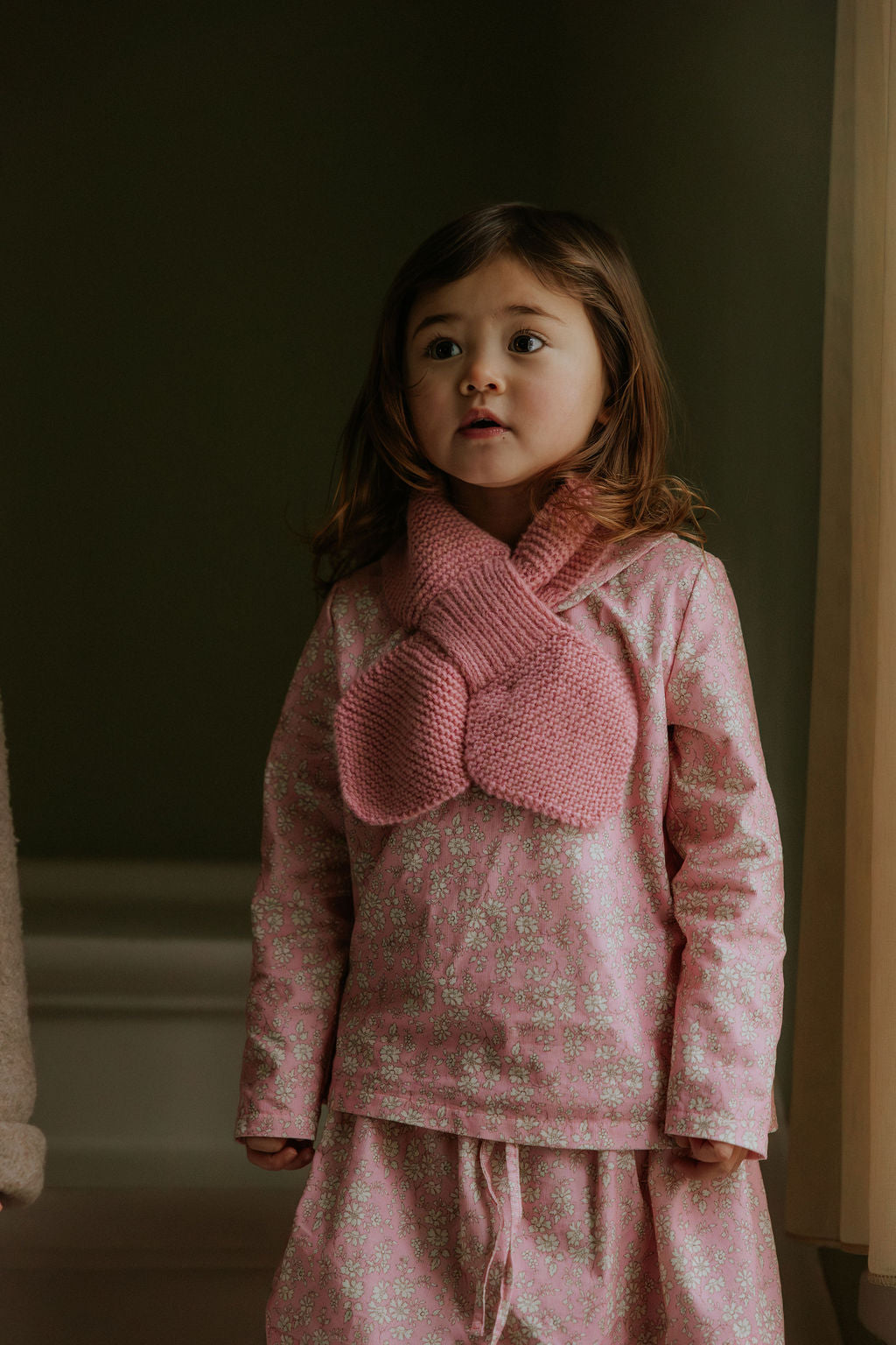 Girl wearing Lalaby Dagmar skirt for kids in pink flower liberty cotton corduroy