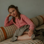 Girl wearing Lalaby Dagmar skirt for kids in tweedy check organic cotton