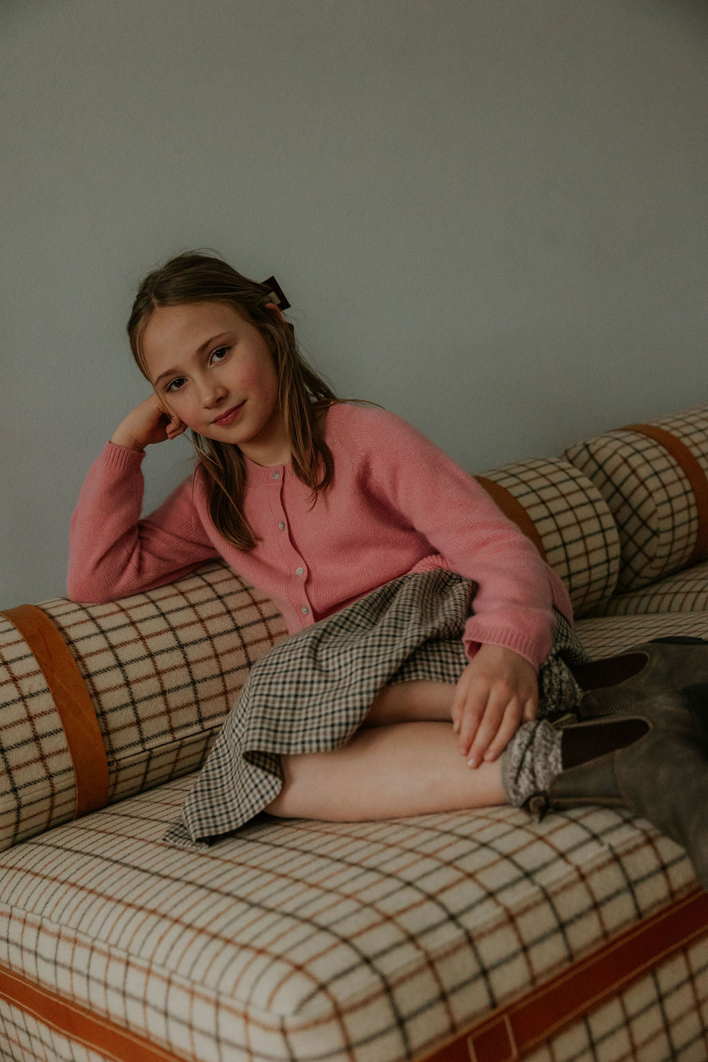 Girl wearing Lalaby Dagmar skirt for kids in tweedy check organic cotton