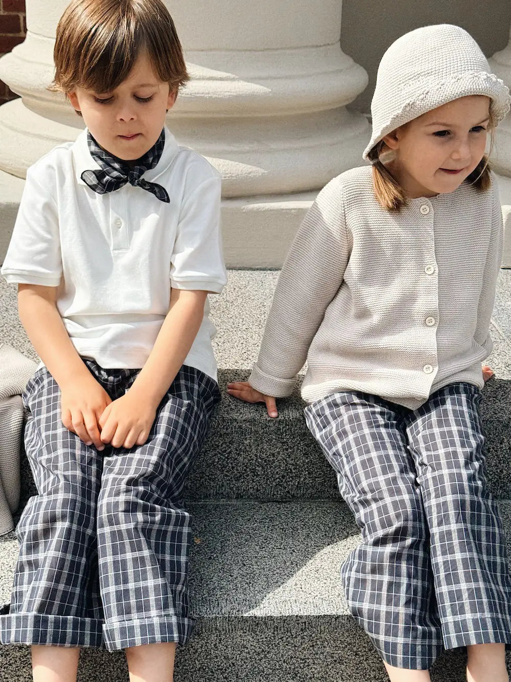 Boy wearing Lalaby Eddie scarf for kids in blue check organic cotton