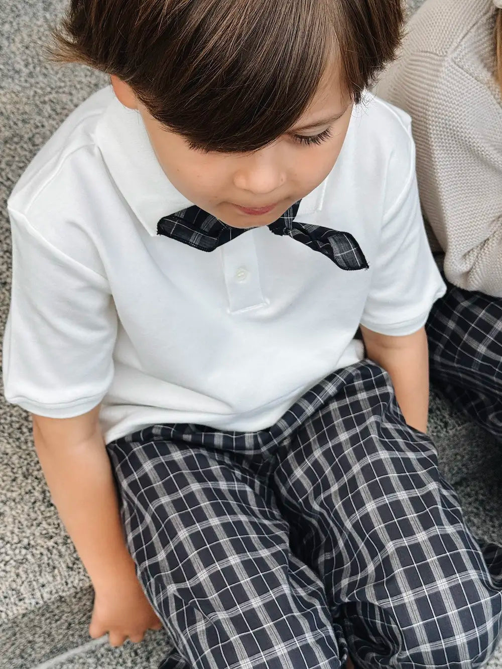 Boy wearing Lalaby Eddie scarf for kids in blue check organic cotton