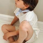 Boy wearing Lalaby eddie scarf for kids and babies in sky blue organic cotton