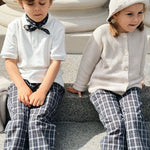 Boy and girl wearing Lalaby Frankie pants for kids in blue check organic cotton
