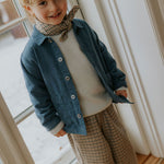 Boy wearing Lalaby Frankie pants for kids in tweedy check organic cotton
