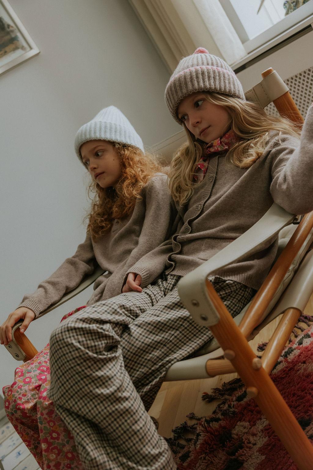 Girl wearing Lalaby Frankie pants for kids in tweedy check organic cotton