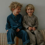 Boy wearing Lalaby Maxi pants for kids in whale blue cotton baby cord