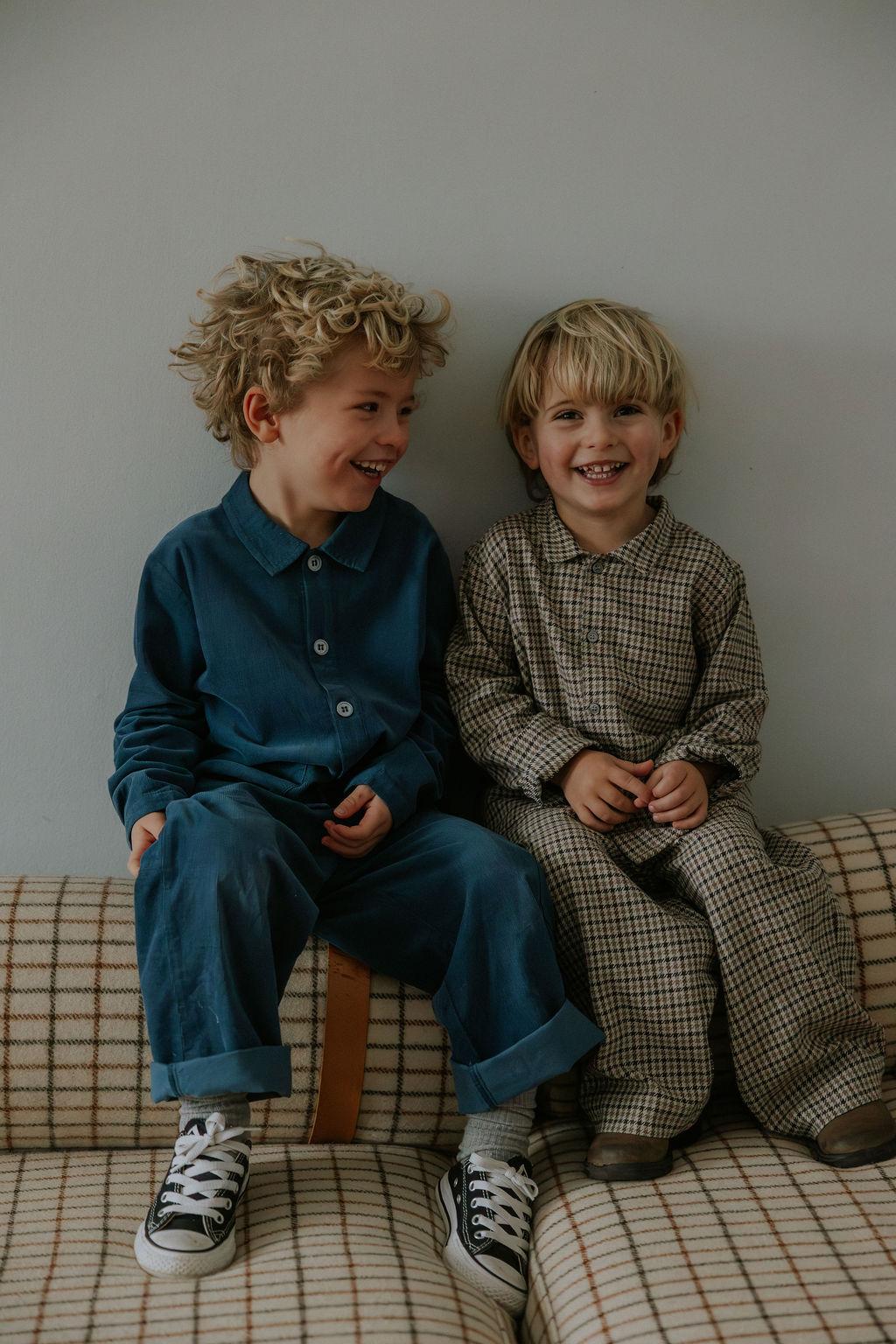 Boy wearing Lalaby Maxi pants for kids in whale blue cotton baby cord