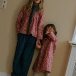 Girl wearing Lalaby Maxi pants for kids in whale blue cotton baby cord