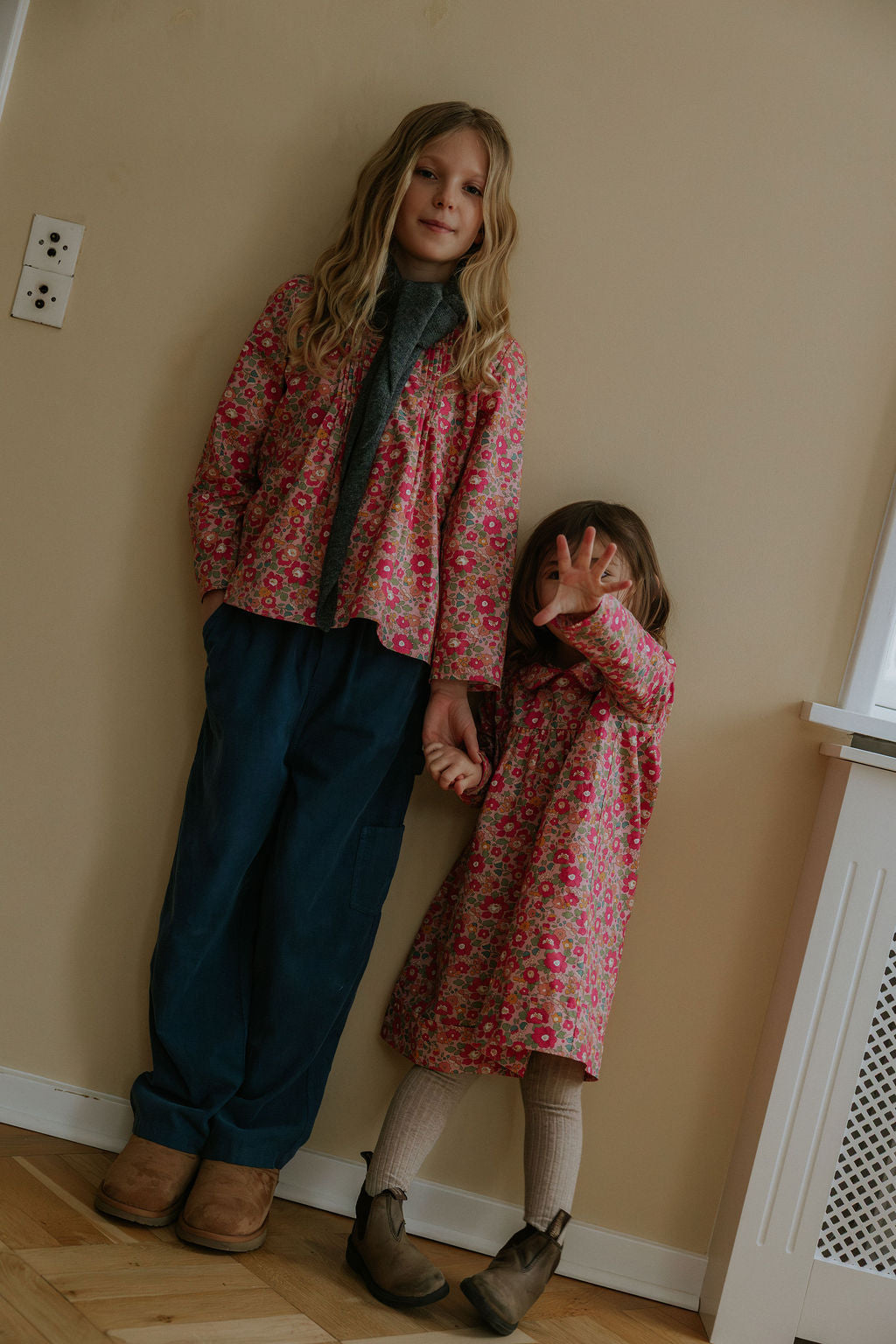 Girl wearing Lalaby Maxi pants for kids in whale blue cotton baby cord