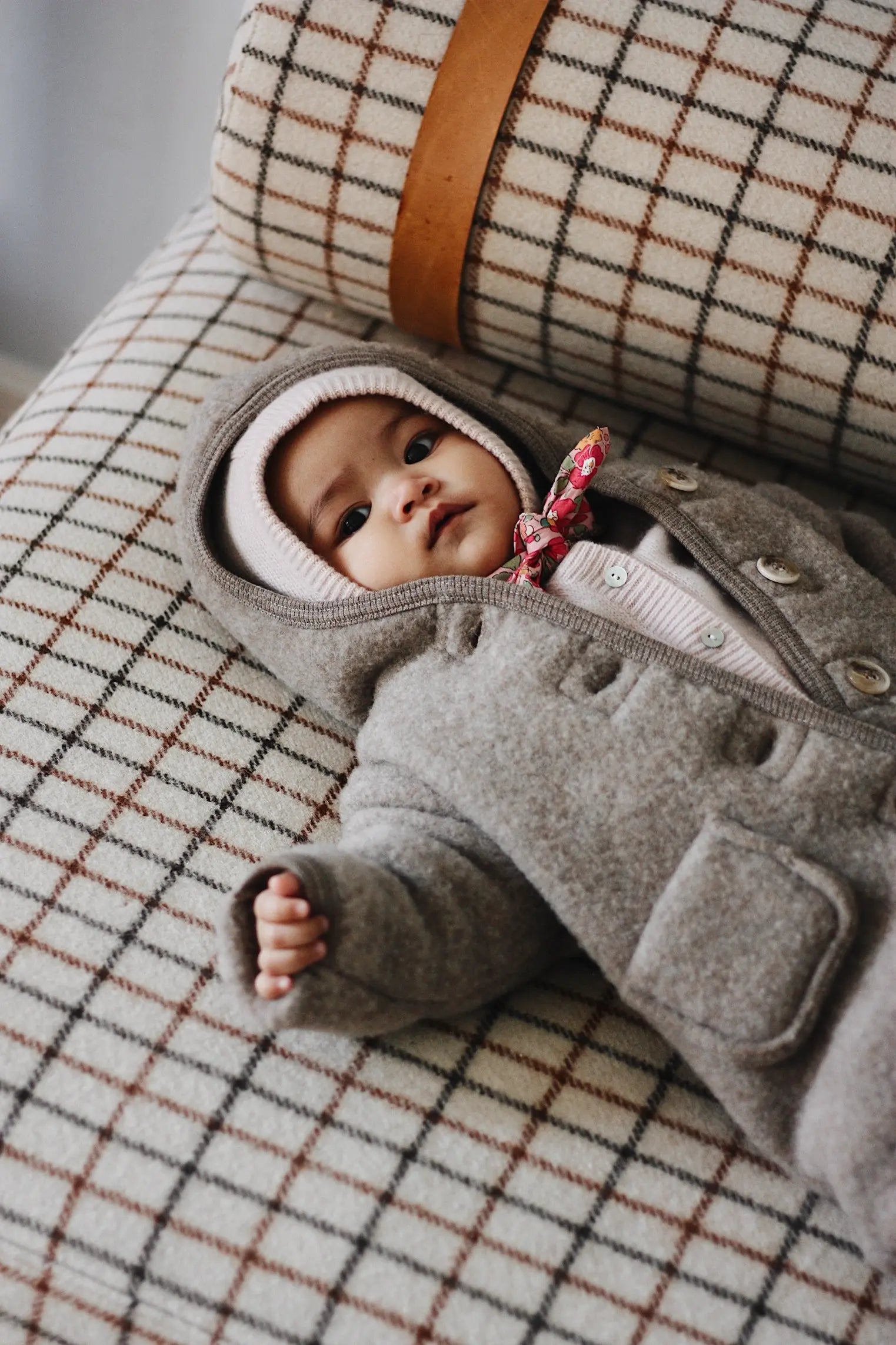 Baby wearing Lalaby Mio balaclava in powder pink cashmere