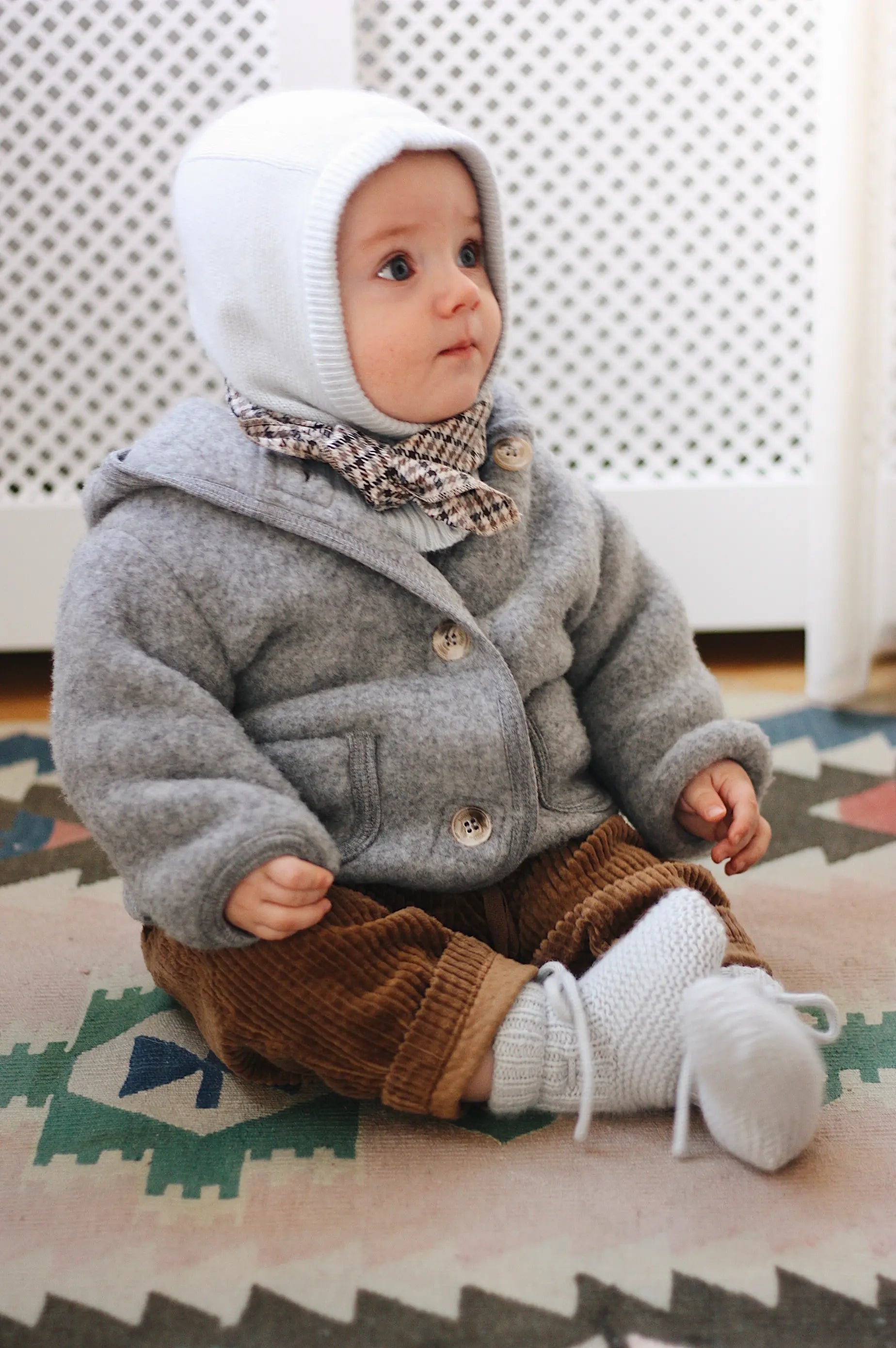 Baby boy wearing Lalaby Mio balaclava for babies and kids in bluey light blue cashmere