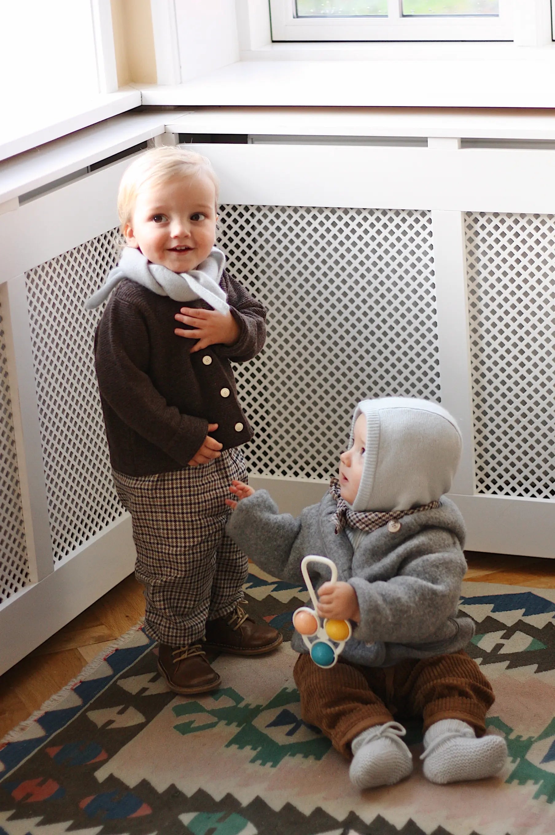 Baby boy wearing Lalaby Mio balaclava for babies and kids in bluey light blue cashmere