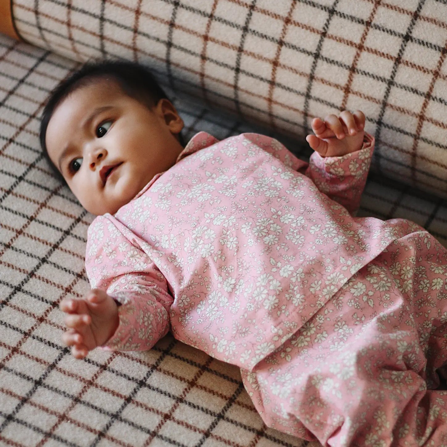Baby girl wearing Lalaby Oya baby top in pink flower cotton liberty corduroy 