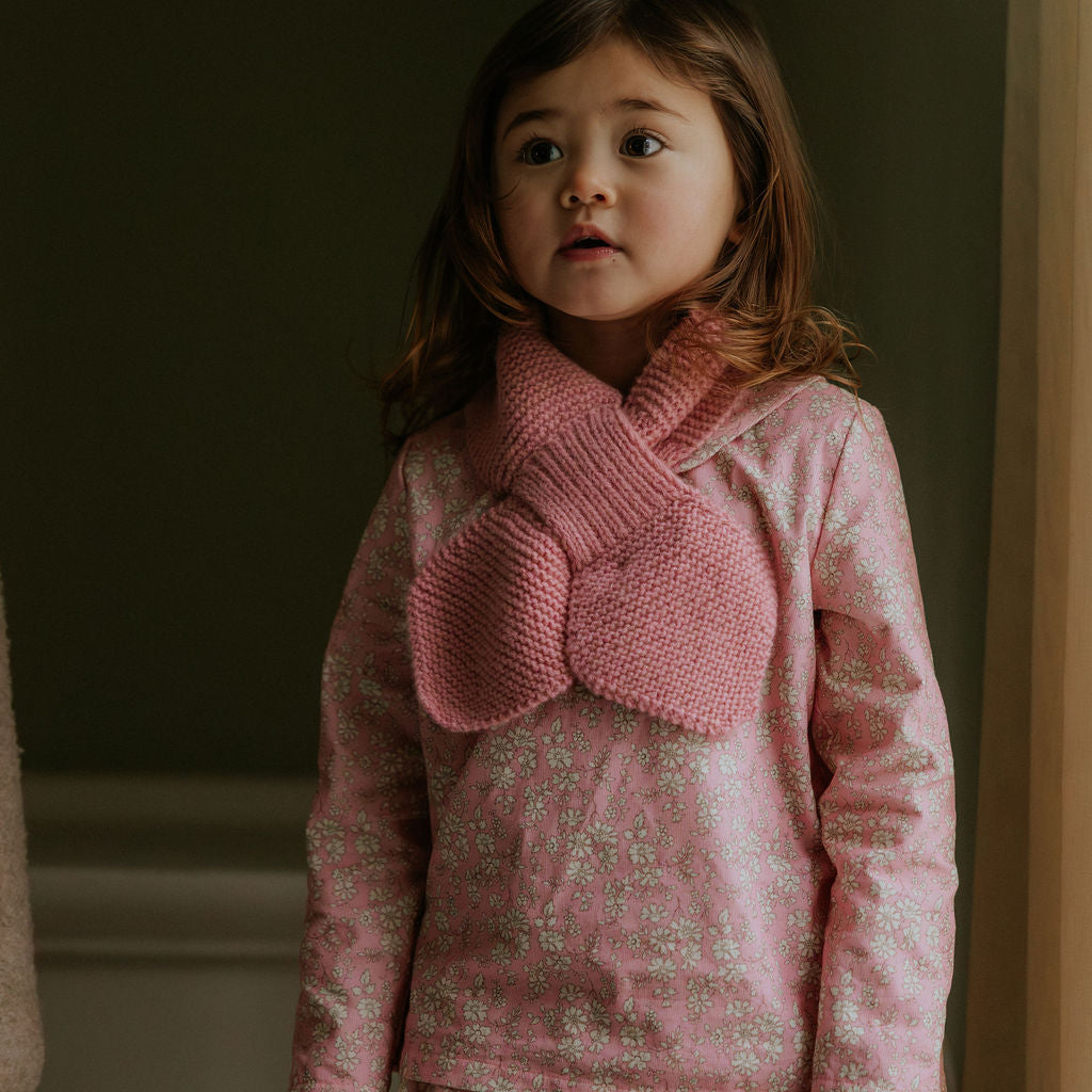 Girl wearing Lalaby Oya kids top in pink flower liberty cotton corduroy