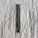 Lalaby pacifier clip for babies in tweedy check organic cotton, with a metal clip for attachment
