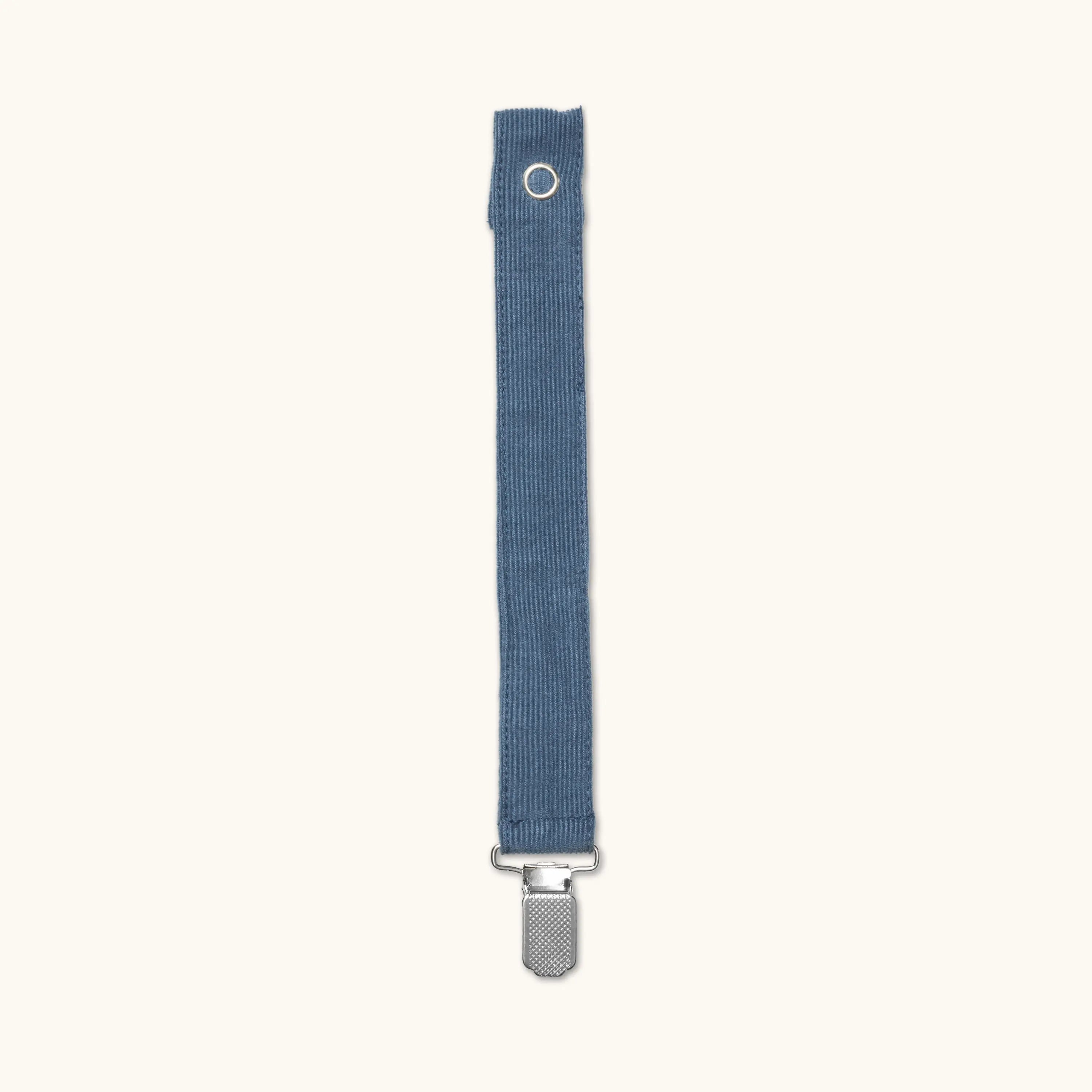 Lalaby pacifier clip in whale blue cotton baby cord with a metal clip for attachment  
