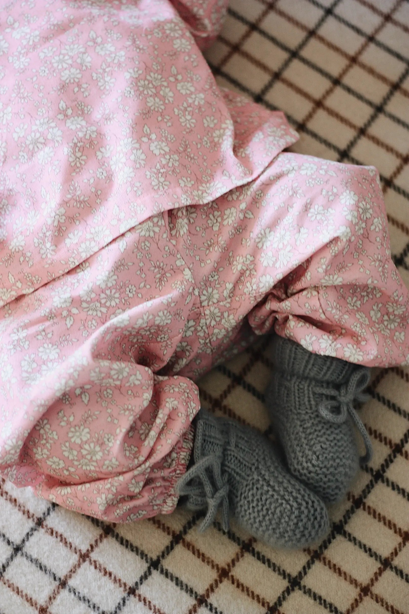 Baby girl wearing Lalaby Pixi pants for babies in pink flower liberty cotton corduroy