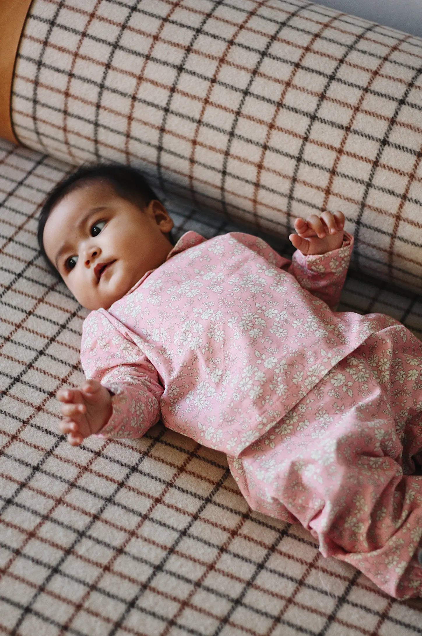 Baby girl wearing Lalaby Pixi pants in pink flower cotton liberty corduroy