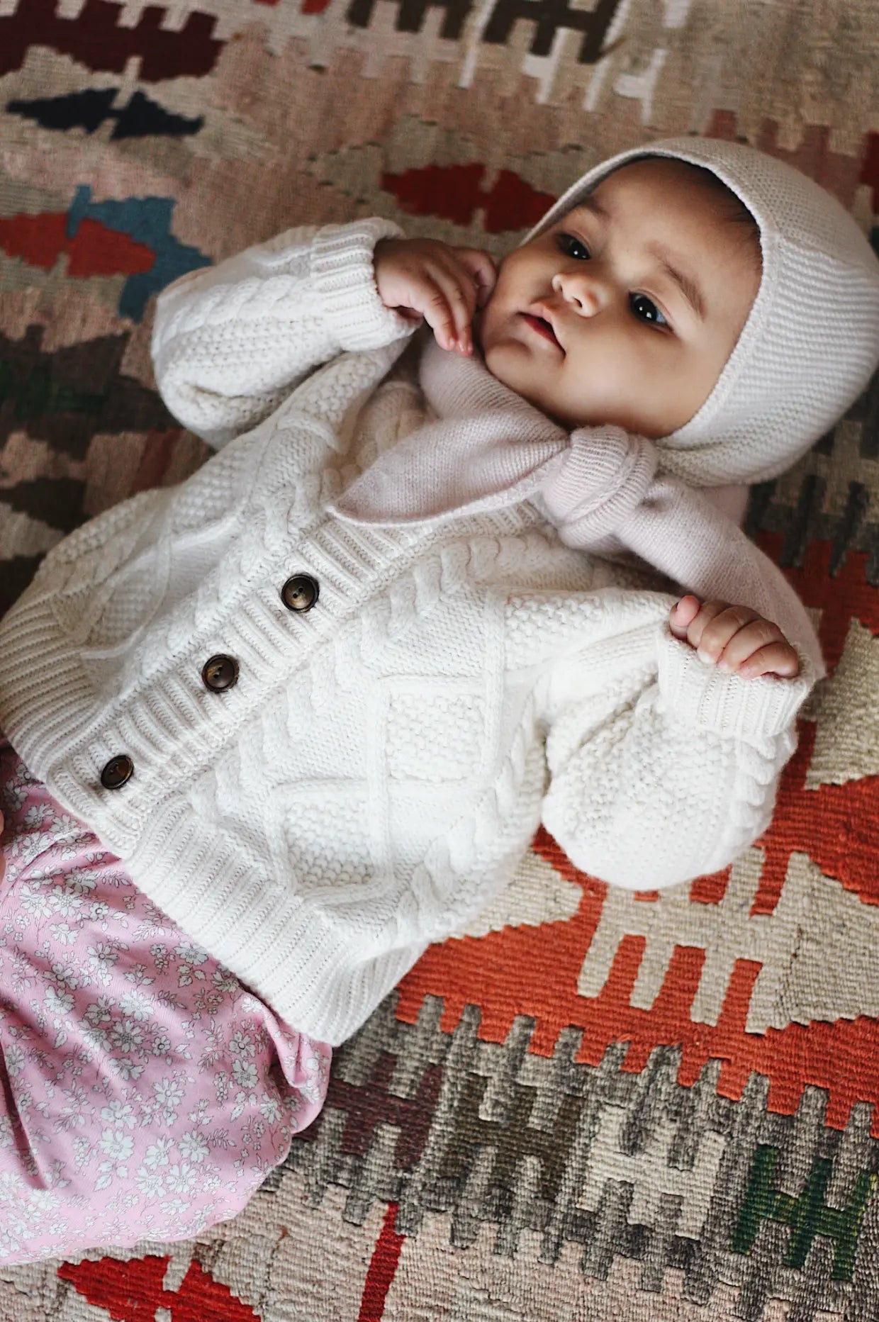 Baby girl wearing Lalaby Pixi pants in pink flower cotton liberty corduroy