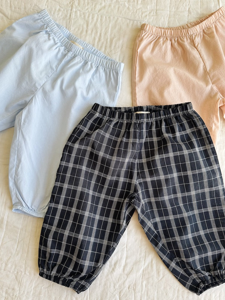 Lalaby pixi baby pants in three colorways: sky blue, blush pink and blue check