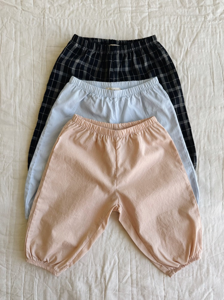 Lalaby pixi baby pants in three colorways: sky blue, blush pink and blue check
